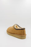 A single men's synthetic suede clog with a decorative black, white, and gold zigzag trim around the collar, shown from a rear three-quarter view on a light gray background.