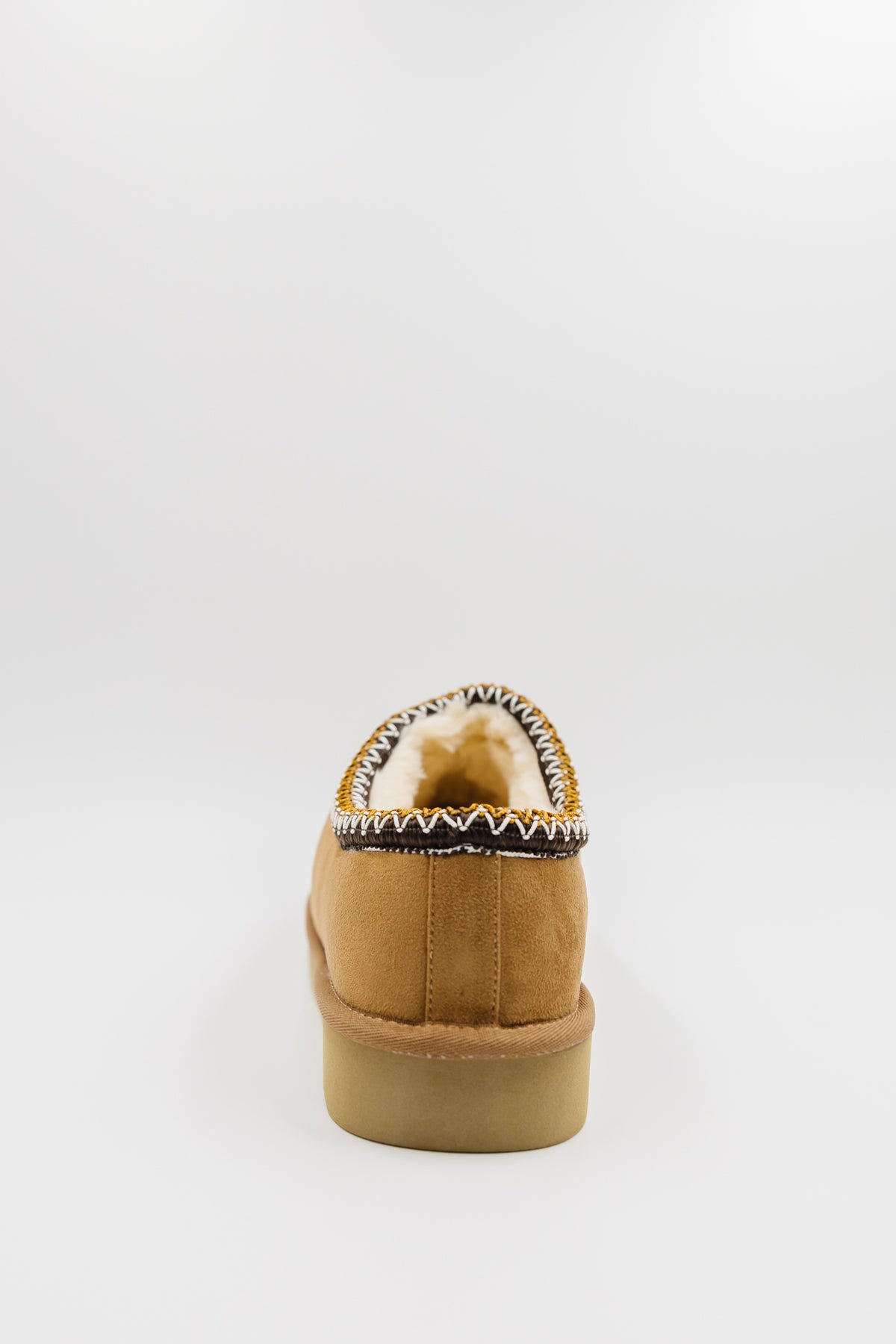 A single men's synthetic suede clog with a decorative black, white, and gold zigzag trim around the collar shown from the back on a light gray background.