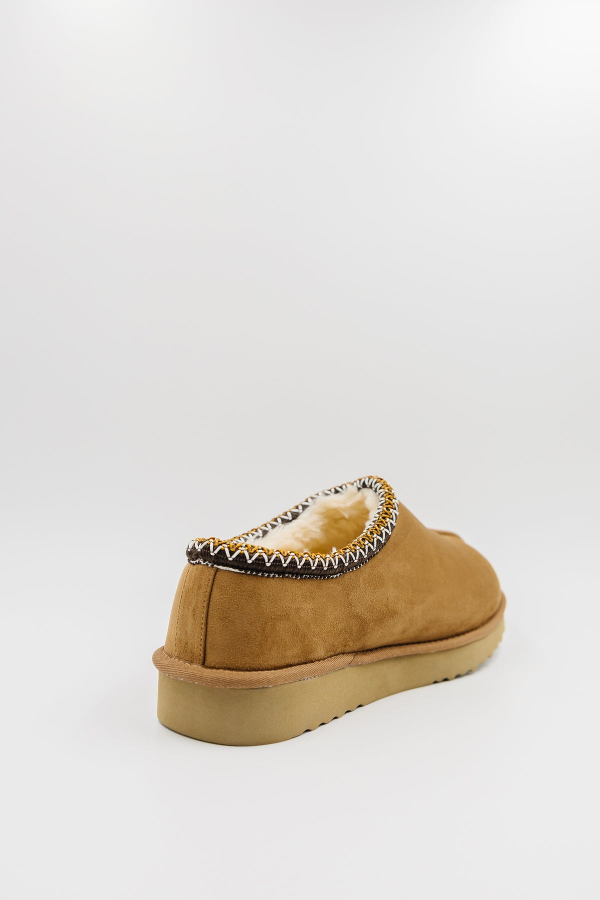 A single men's synthetic suede clog with a decorative black, white, and gold zigzag trim around the collar shown from a rear three-quarter angle on a light gray background.